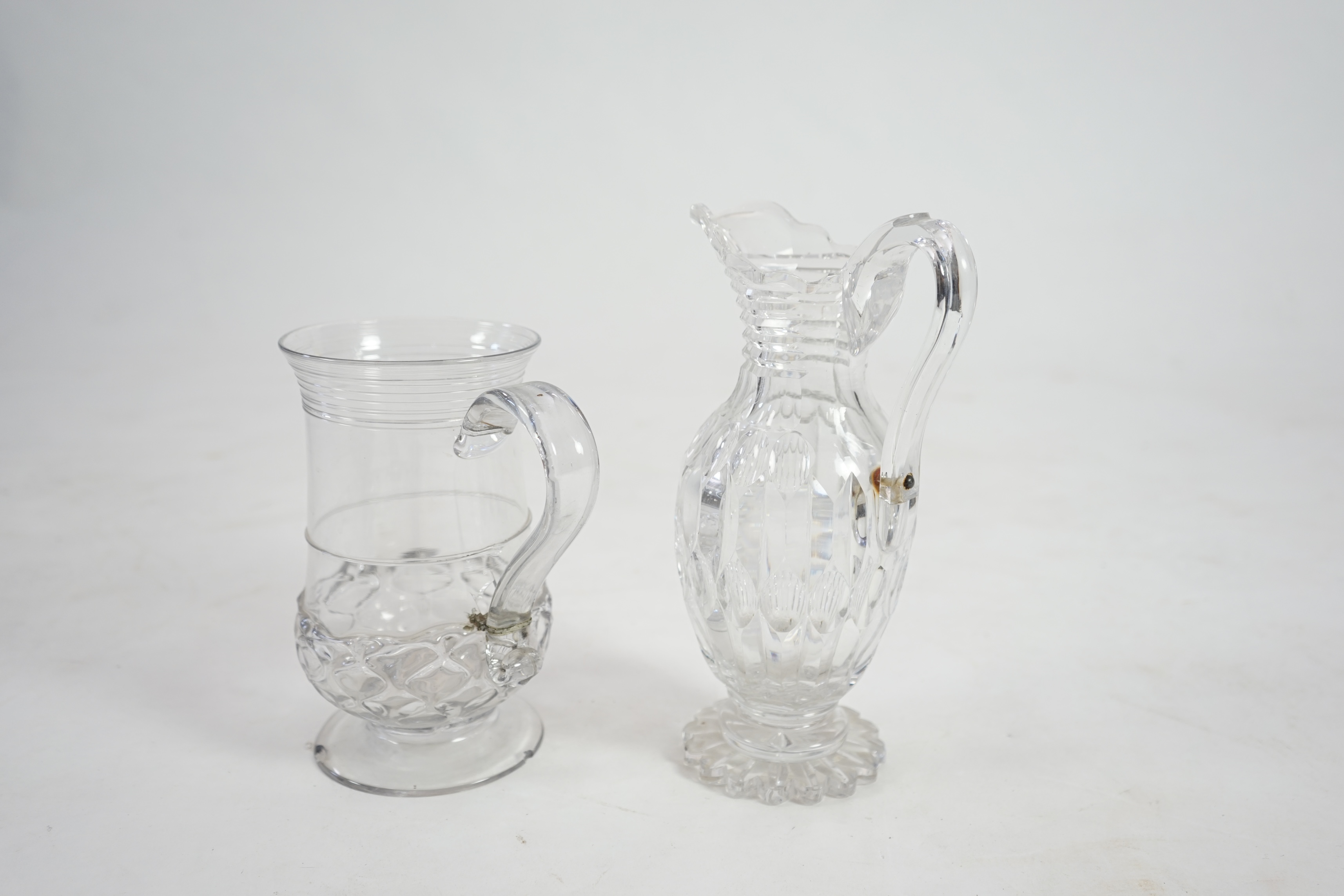 An 18th century wrythen moulded glass ale jug